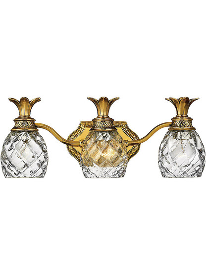 Pineapple Triple Bath Sconce With Clear Optic Glass in Burnished Brass.